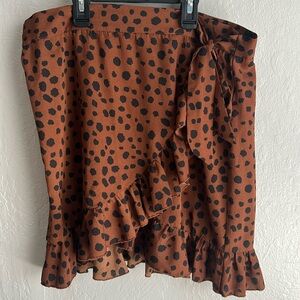 Woman’s SHEIN size L leopard print tie wrap skirt.